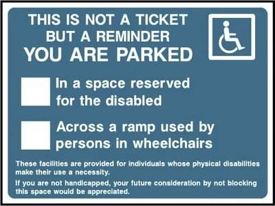 This Is Not A Ticket But A Reminder — You Are Parked — In a space reserved for the disabled or across a ramp used by persons in wheelchairs sign. blue-grey accessibility parking reminder with