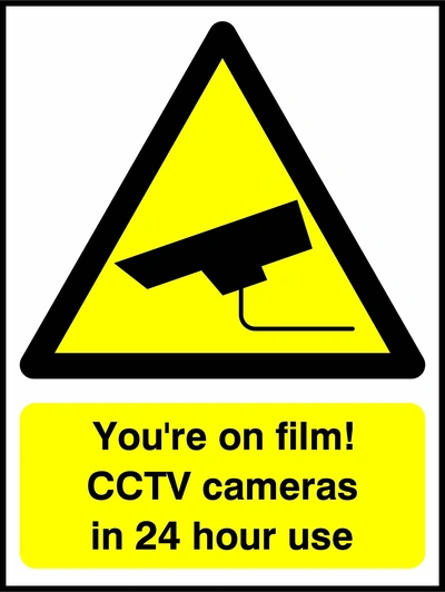 You're on film! CCTV cameras in 24 hour use sign. yellow CCTV camera warning triangle and wording. Artwork SECU0043.