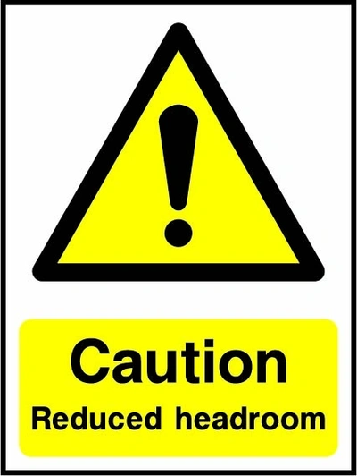 Caution — Reduced headroom sign showing yellow exclamation warning triangle above wording. Artwork LIFT0005.