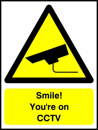 Smile! You're on CCTV sign. yellow CCTV camera warning triangle and wording. Artwork SECU0040.