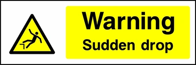 Yellow and black sign with a falling person pictogram and Warning — Sudden drop wording. CONS0042 artwork.